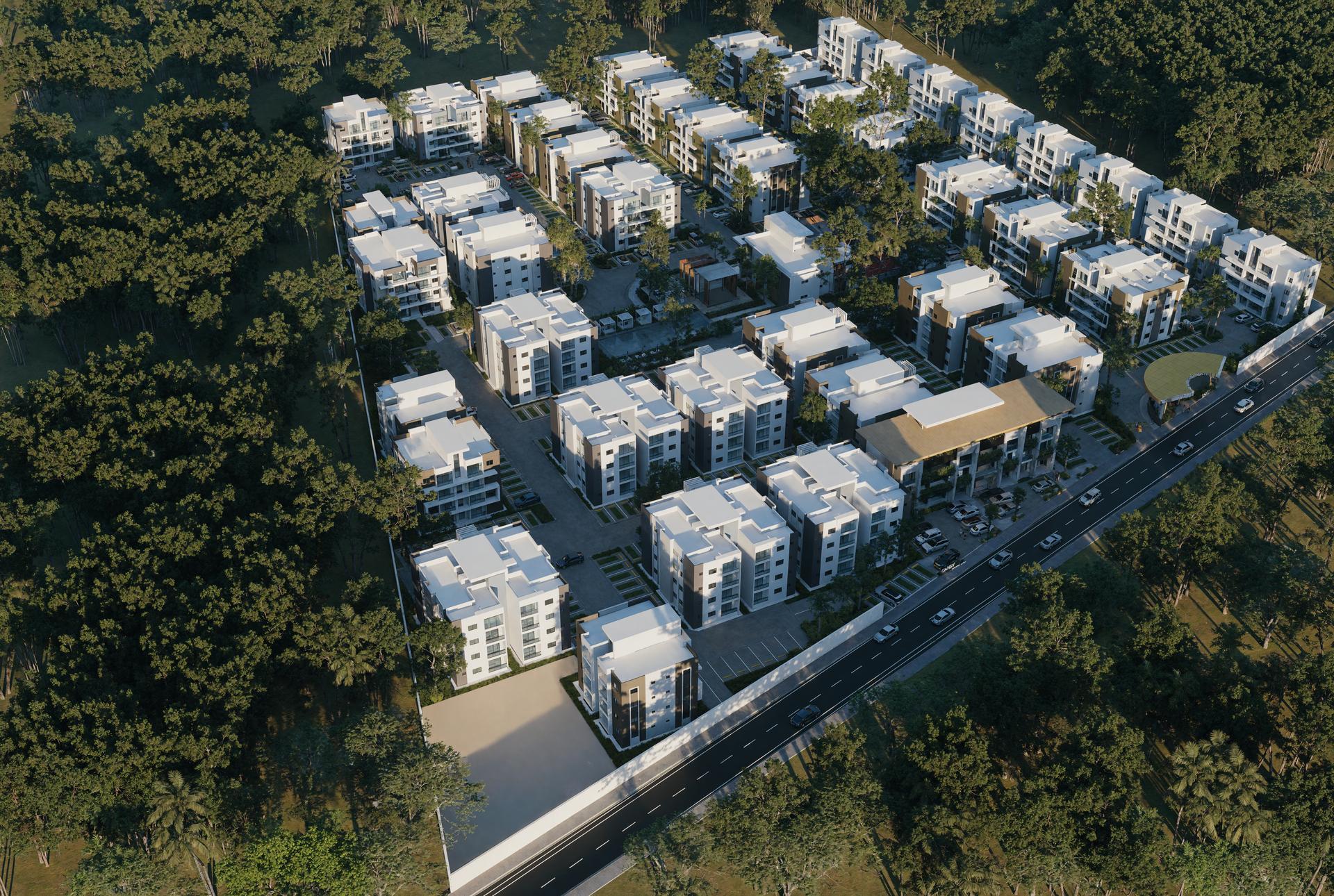 Vista aérea del conjunto residencial Caney Oriental, edificios de apartamentos rodeados de vegetación